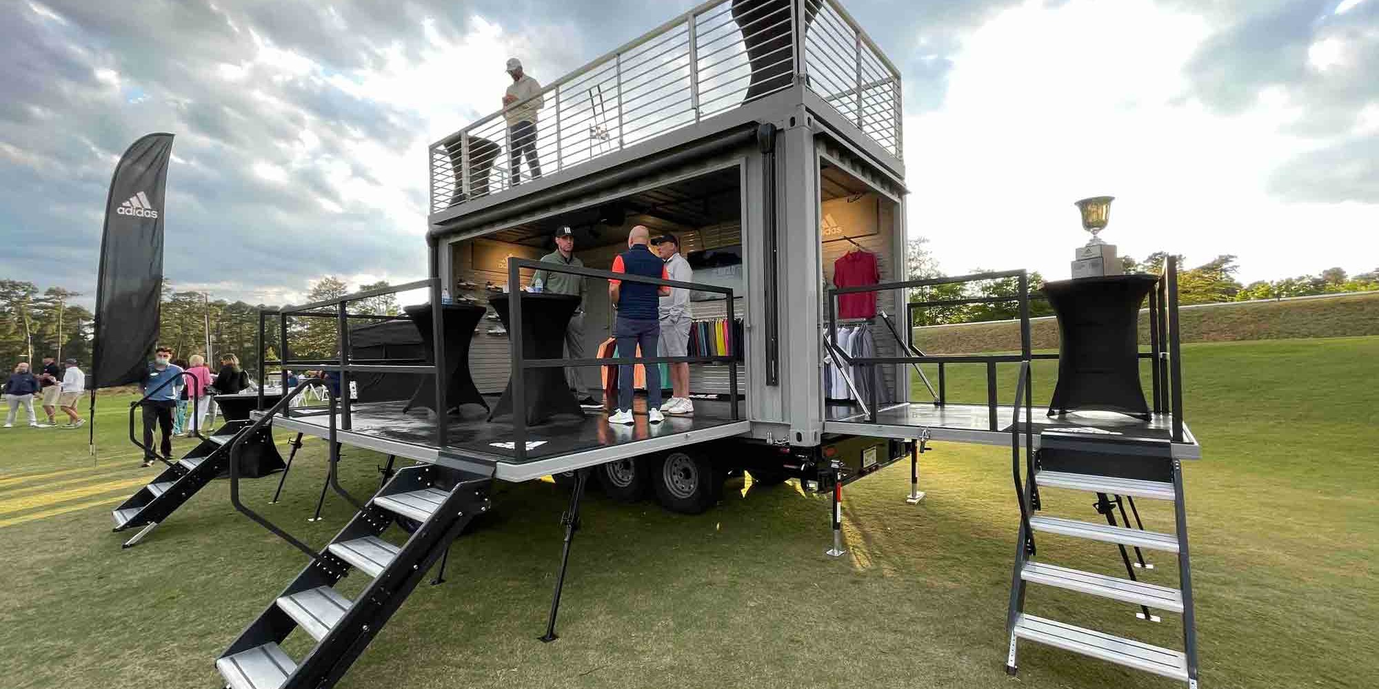 Front view of the staircase to the rooftop deck of ROXBOX Containers' custom Adidas Golf PGA Tour shipping container mobile experiential marketing activation.