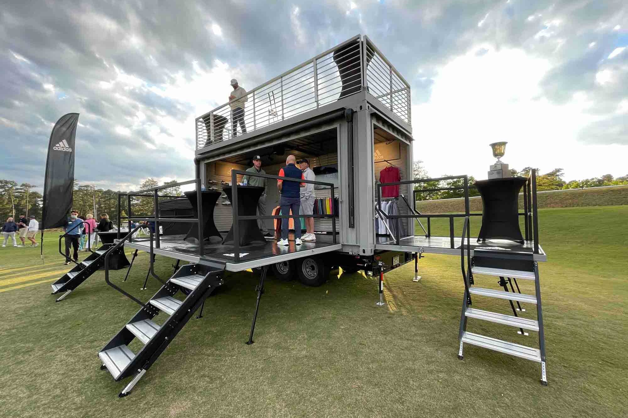 Front view of the staircase to the rooftop deck of ROXBOX Containers' custom Adidas Golf PGA Tour shipping container mobile experiential marketing activation.