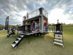 Front view of the staircase to the rooftop deck of ROXBOX Containers' custom Adidas Golf PGA Tour shipping container mobile experiential marketing activation.