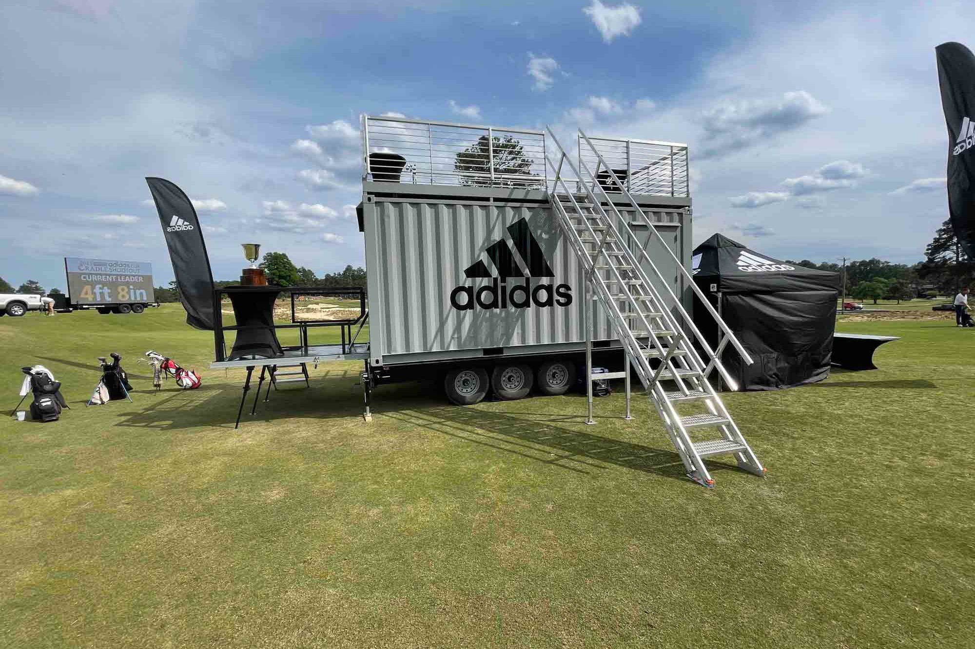 Backside view of the staircase to the rooftop deck of ROXBOX Containers' custom Adidas Golf PGA Tour shipping container mobile experiential marketing activation.