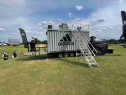 Backside view of the staircase to the rooftop deck of ROXBOX Containers' custom Adidas Golf PGA Tour shipping container mobile experiential marketing activation.