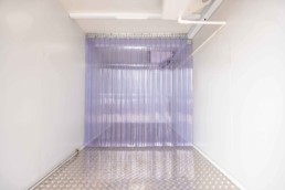 Inside cooler view of ROXBOX Containers 20' HELIOS Solar shipping container refrigeration unit.