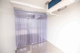 Inside cooler view of ROXBOX Containers 20' HELIOS Solar shipping container refrigeration unit.
