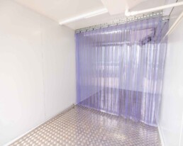 Inside cooler view of ROXBOX Containers 20' HELIOS Solar shipping container refrigeration unit.