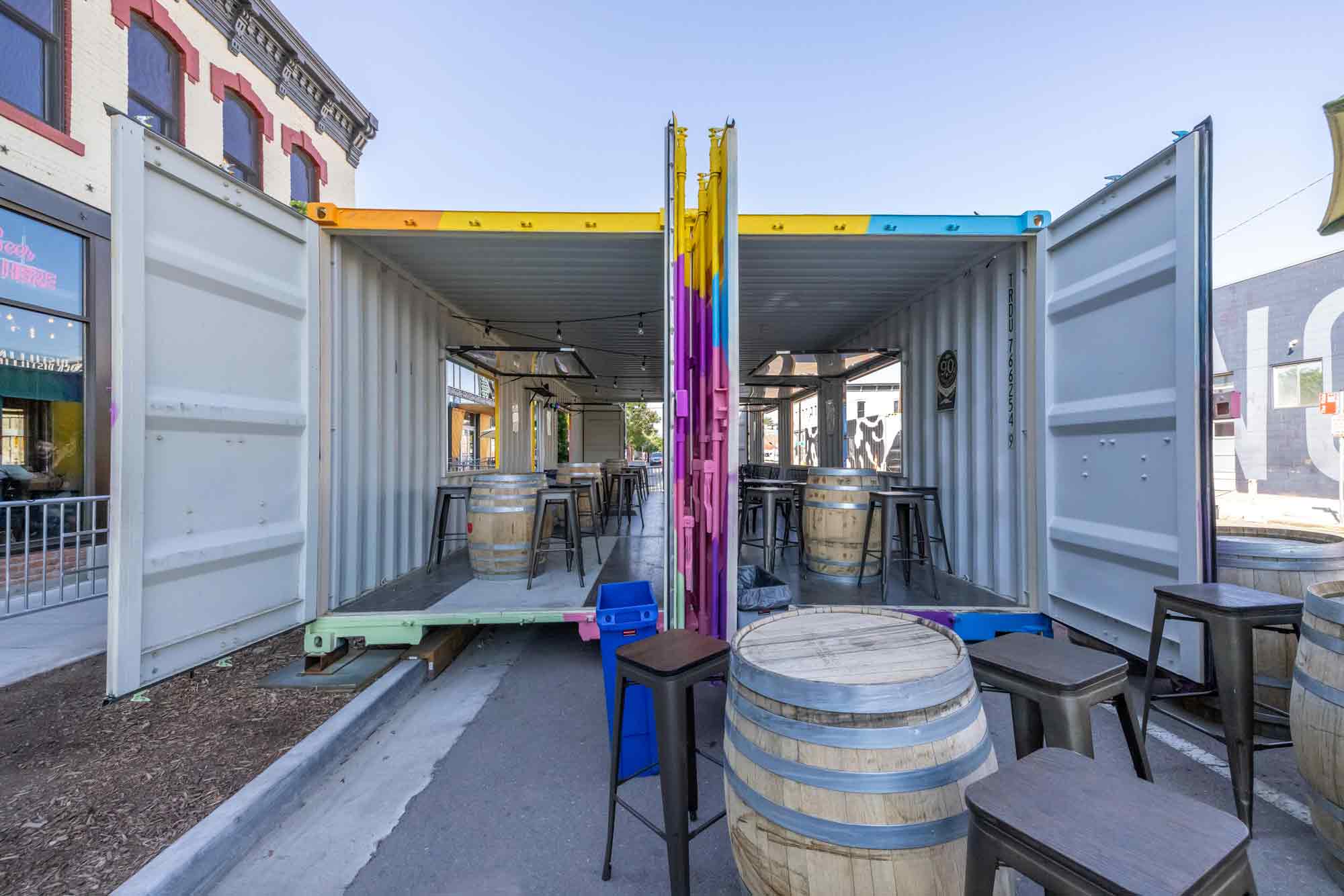 Side view of Odell Brewing Co.'s custom shipping container patio in the RiNo Art District of Denver, Colorado, built by ROXBOX Containers.