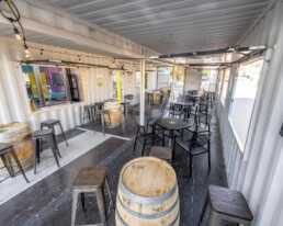 Inside Odell Brewing Co.'s custom shipping container patio in the RiNo Art District of Denver, Colorado, built by ROXBOX Containers.