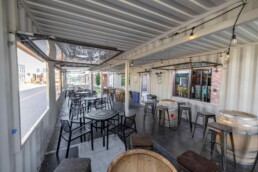 Inside Odell Brewing Co.'s custom shipping container patio in the RiNo Art District of Denver, Colorado, built by ROXBOX Containers.