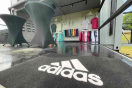 Retail space and showroom in ROXBOX Containers' custom Adidas Golf PGA Tour shipping container mobile experiential marketing activation.