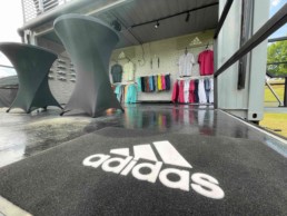 Retail space and showroom in ROXBOX Containers' custom Adidas Golf PGA Tour shipping container mobile experiential marketing activation.