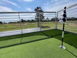 Putting green on the rooftop deck of ROXBOX Containers' custom Adidas Golf PGA Tour shipping container mobile experiential marketing activation.