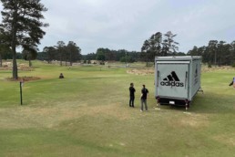 Closed view of ROXBOX Containers' custom Adidas Golf PGA Tour shipping container mobile experiential marketing activation.