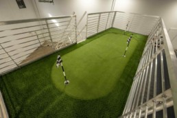 Putting green on the rooftop deck of ROXBOX Containers' custom Adidas Golf PGA Tour shipping container mobile experiential marketing activation.