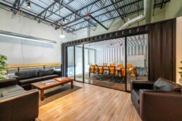 View of the conference room in Eldorado Climbing Walls shipping container office space built by ROXBOX Containers.