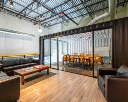 View of the conference room in Eldorado Climbing Walls shipping container office space built by ROXBOX Containers.