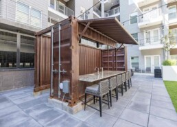 Price Development Group custom shipping container patio bar built by ROXBOX Containers.