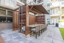 Price Development Group custom shipping container patio bar built by ROXBOX Containers.