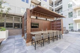 Price Development Group custom shipping container patio bar built by ROXBOX Containers.