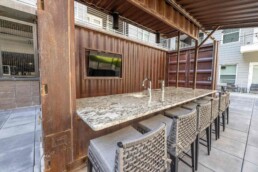 Price Development Group custom shipping container patio bar built by ROXBOX Containers.