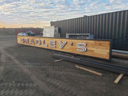 Custom sign for Bradley's custom shipping container kitchen at Winter Park Resort built by ROXBOX Containers.