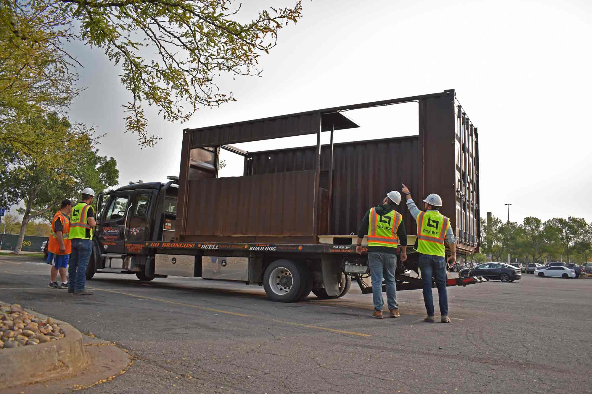 Price Development Group's custom shipping container patio bar built by ROXBOX Containers being delivered into location.