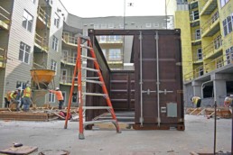 Price Development Group's custom shipping container patio bar built by ROXBOX Containers being delivered into location.